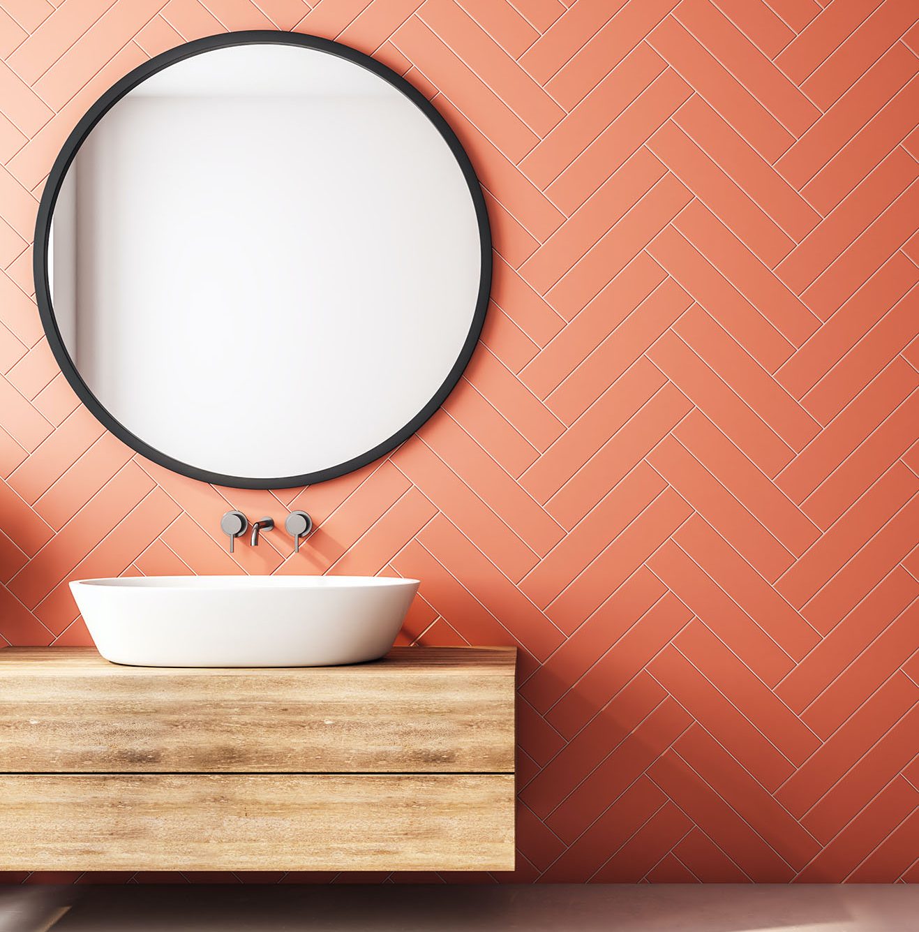 Modern orange bathroom interior with decorative tree, sink, round mirror, sunlight and copy space. 3D Rendering